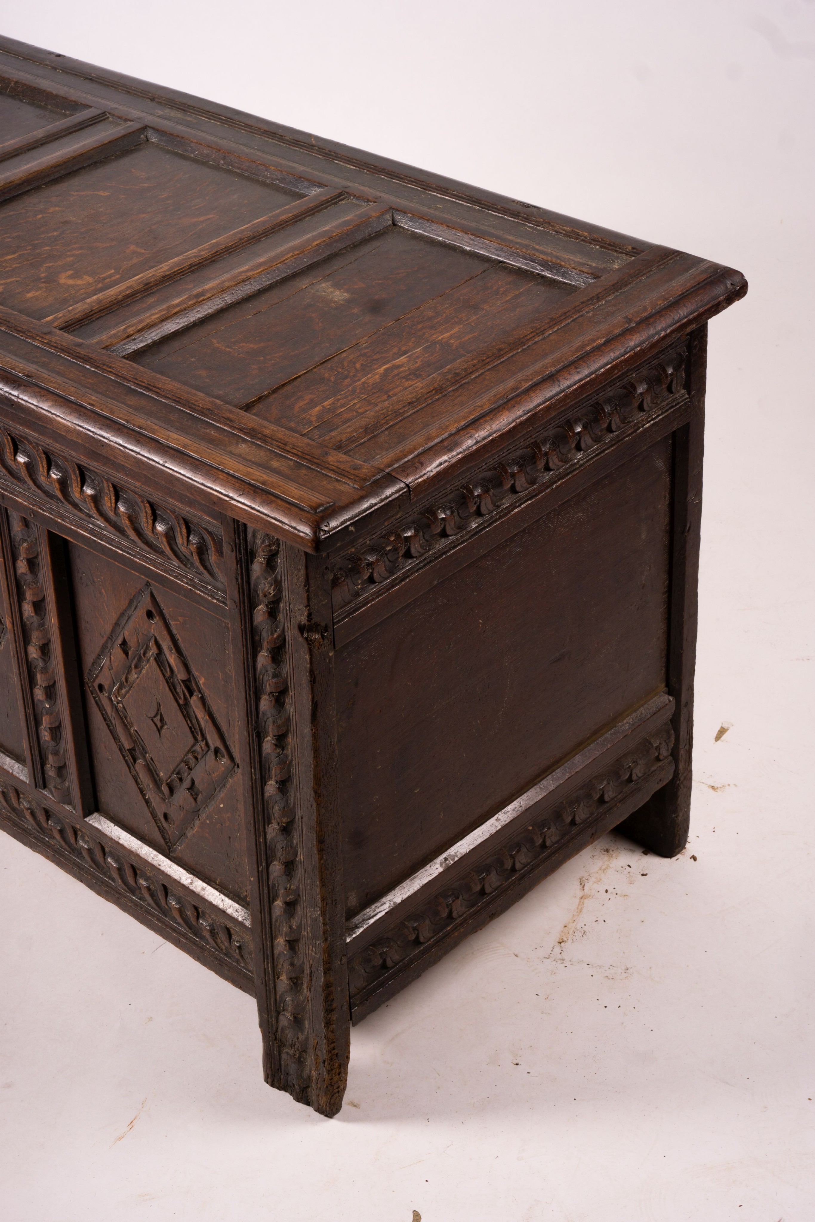 A 17th century carved panelled oak coffer, length 115cm, depth 56cm, height 67cm